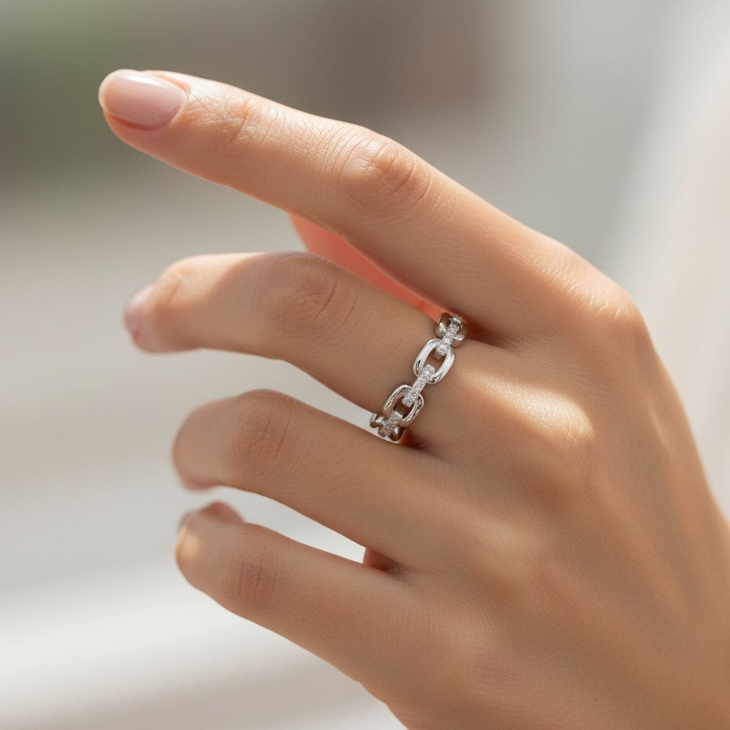 LUMIOR Omnia™ Unisex Eternity Moissanite Band in 925 Sterling Silver with a rhodium finish, featuring a link chain design with micro-set moissanite stones.