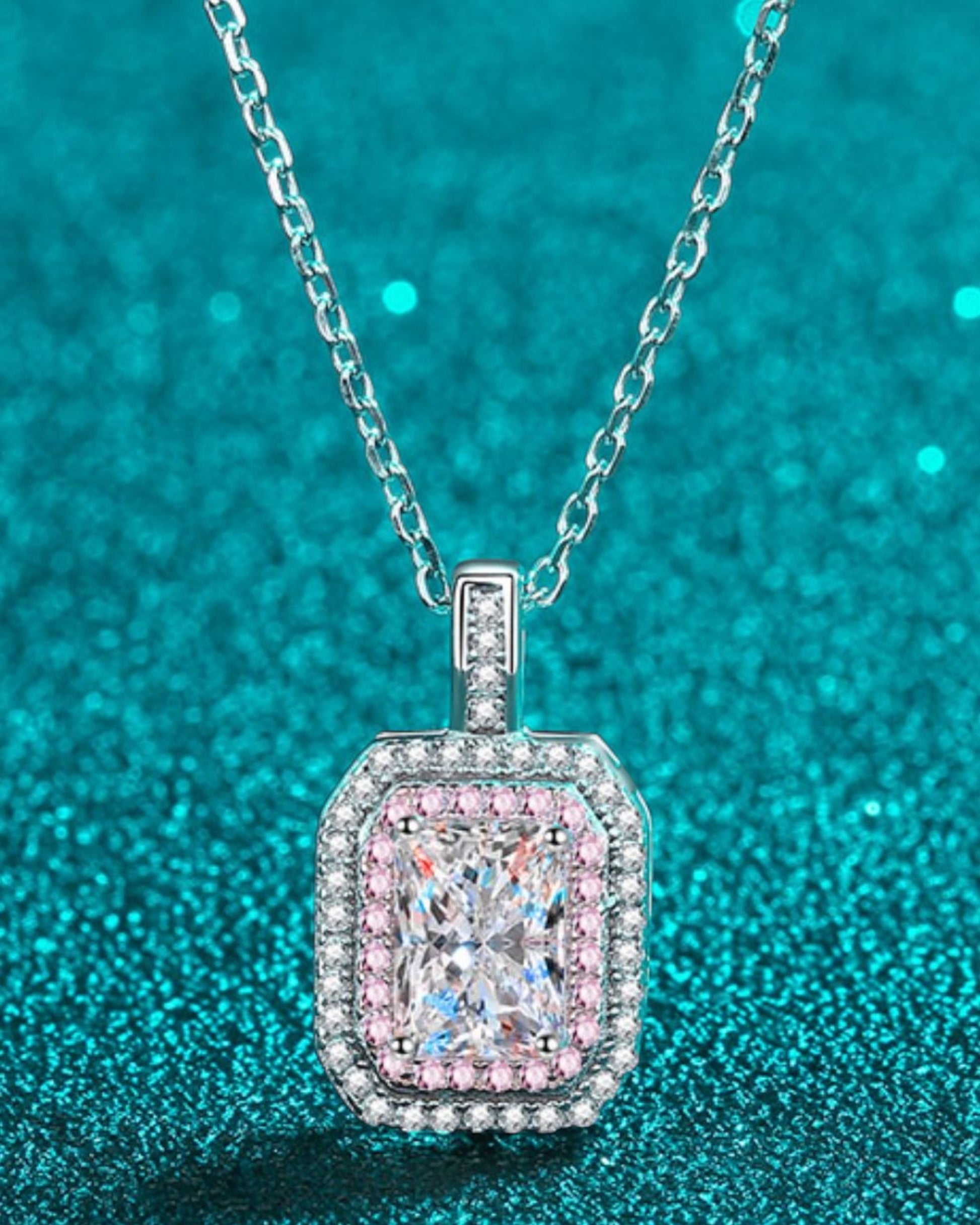 LUMIOR minimalistische 1 karaat moissaniet hanger ketting van sterling zilver met roze en witte accentstenen.