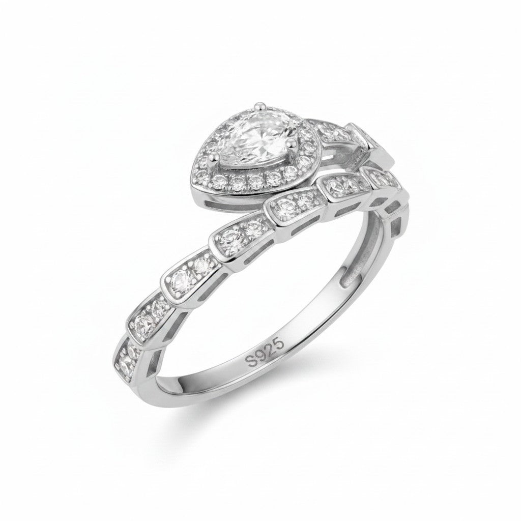 LUMIOR Serpentina™ ring in rose gold plated sterling silver, shaped like a snake with moissanite stones. Pear-cut center stone.