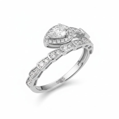 LUMIOR Serpentina™ ring in rose gold plated sterling silver, shaped like a snake with moissanite stones. Pear-cut center stone.